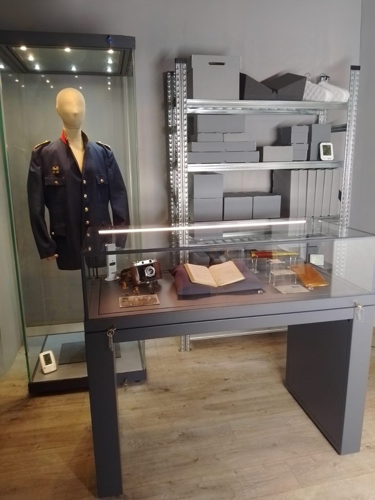 Image showing examples of the products available from Darac in use - Museum showcases, mannequins, climate monitoring equipment, storage shelving, archival boxes, book supports, book cushions, acrylic display mounts, display numbering. 